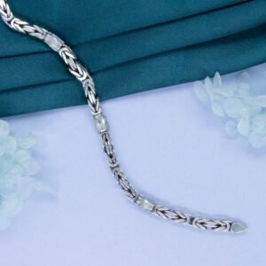 Oxidized silver woven bracelet with icy clear crystals, styled elegantly by Luxer